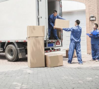 Three Movers blue Uniform Loading House items box in Truck
