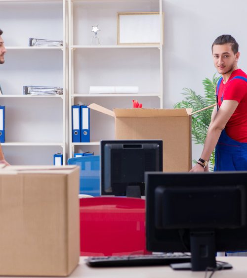 One Mover in blue and red uniform packing office supply